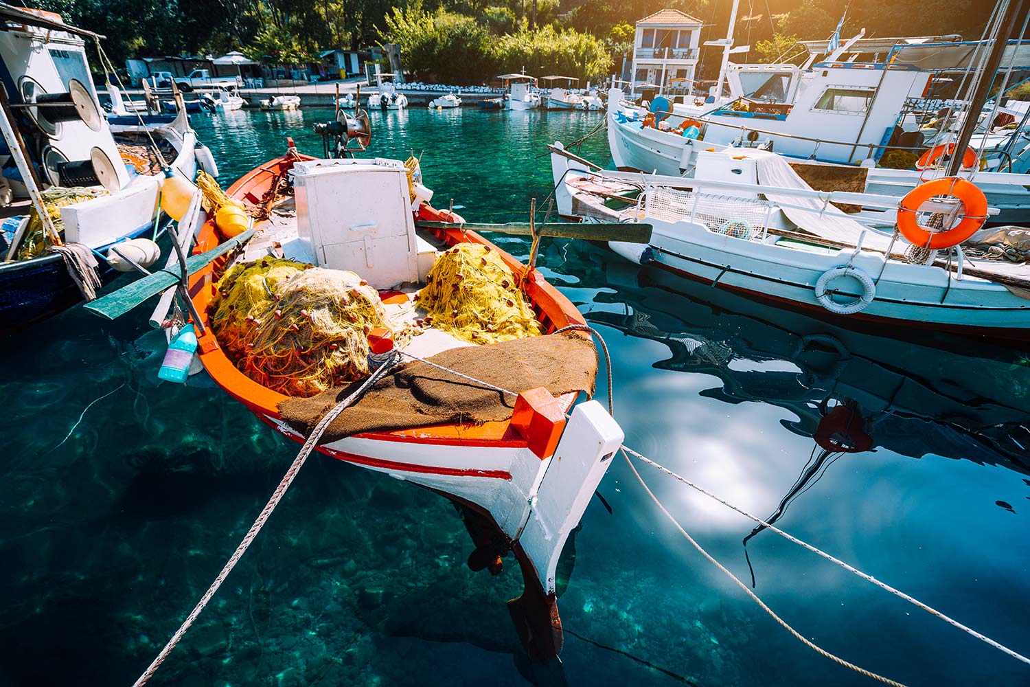 colorful-greek-fishing-boats-in-small-port-harbor-resize.jpg